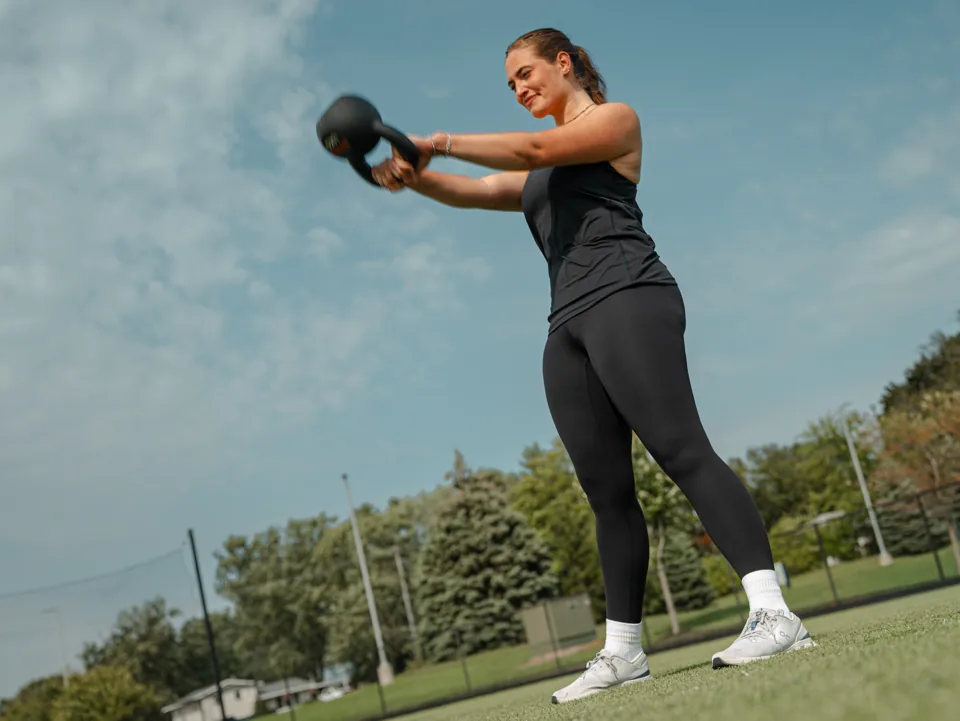 Klomper athlete practicing a kettlebell swing