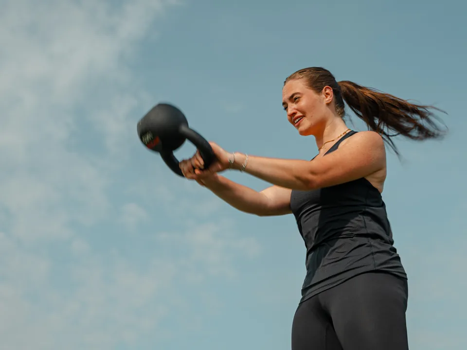 Athlete completing a kettlebell swing